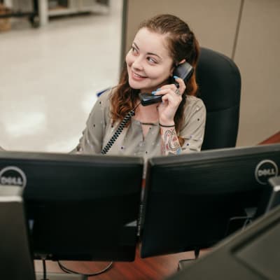Resources-Parent-Support EXILE Technologies employee on the phone