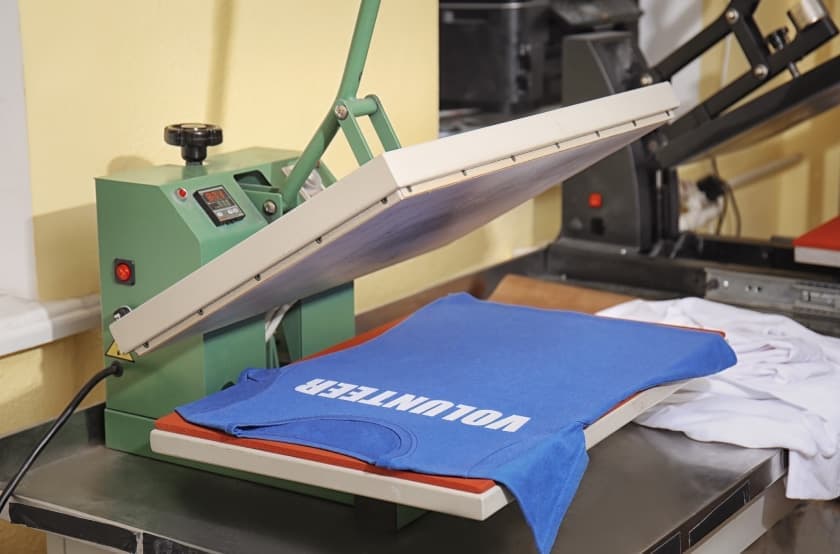 blue shirt on a heat press