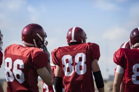 football players in polyester jerseys 