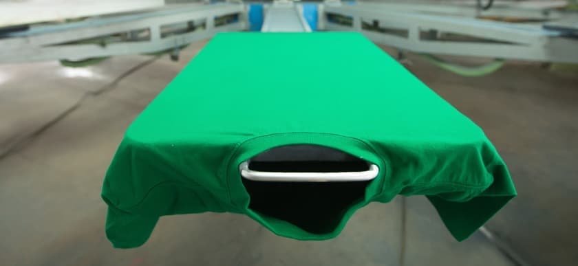 green t-shirt on a press 